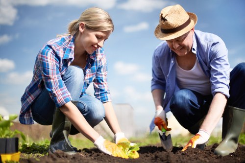 Volunteers sorting garden waste into recycling streams
