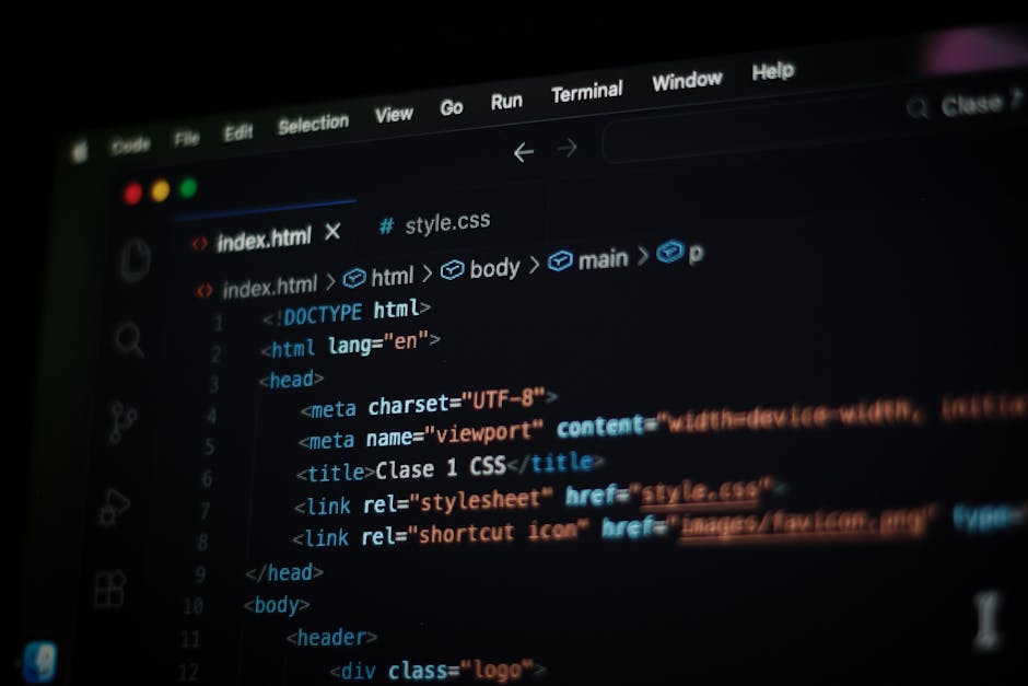 A close-up photograph of a computer screen displaying lines of HTML code in a text editor. The code includes tags such as <html>, <head>, <title>, and <meta>, with syntax highlighting in various color